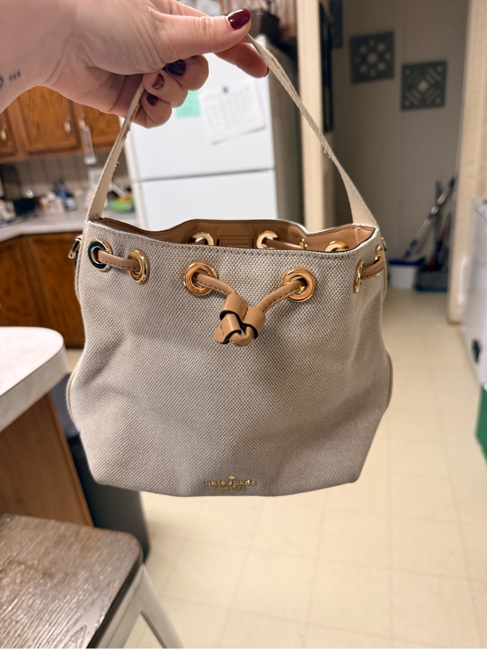 kate spade beige canvas drawstring shoulder bag with gold hardware